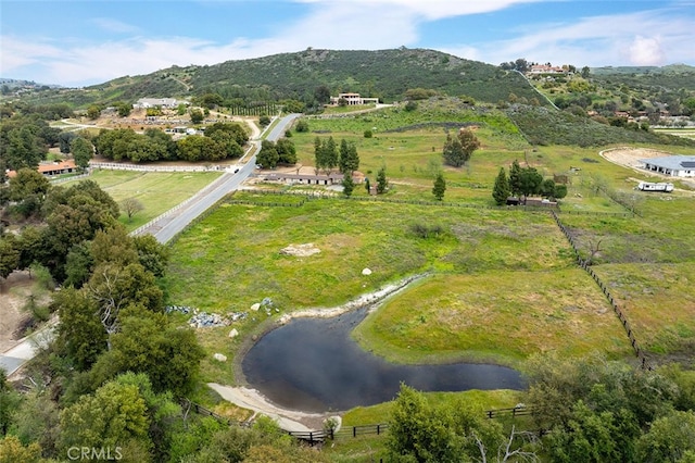 drone / aerial view with a rural view and a water and mountain view