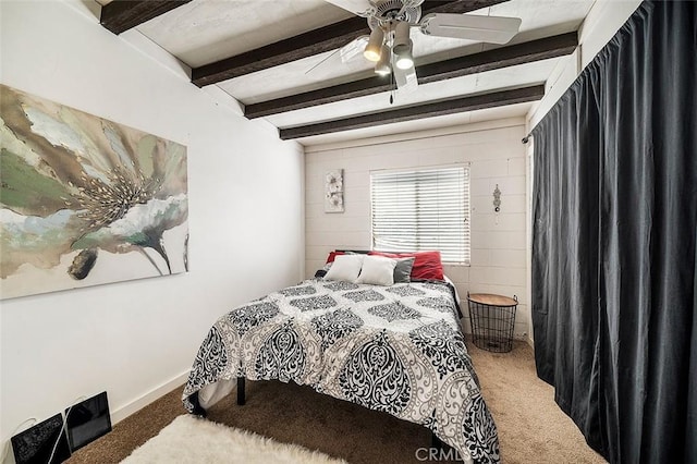 bedroom with beam ceiling, ceiling fan, and carpet flooring