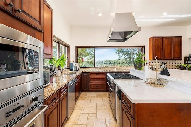 kitchen with stainless steel appliances, island exhaust hood, sink, and light stone counters