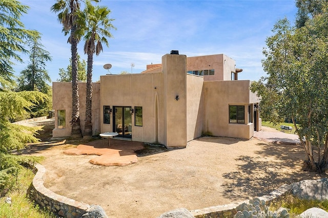 back of property with a patio area