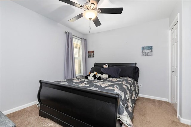 bedroom with light carpet and ceiling fan