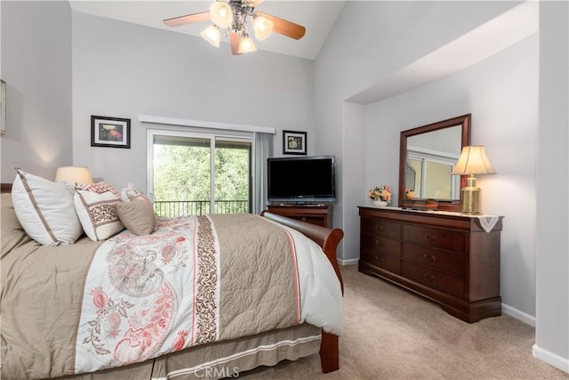 carpeted bedroom featuring ceiling fan, lofted ceiling, and access to outside