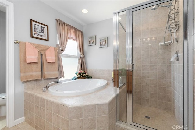 bathroom with separate shower and tub and toilet