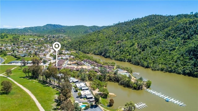 birds eye view of property featuring a water and mountain view