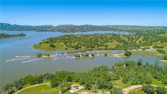 bird's eye view featuring a water and mountain view