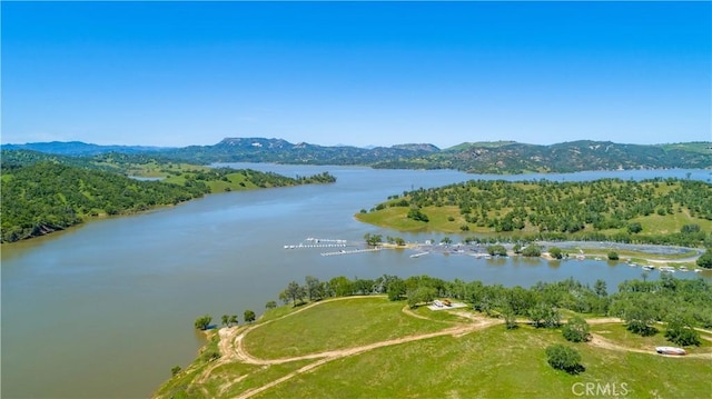 bird's eye view featuring a water and mountain view
