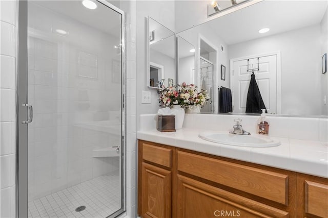 bathroom with vanity and walk in shower