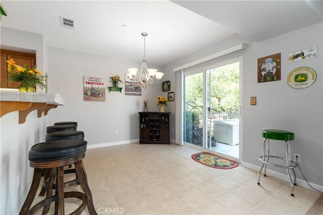 interior space with light tile patterned floors and a chandelier