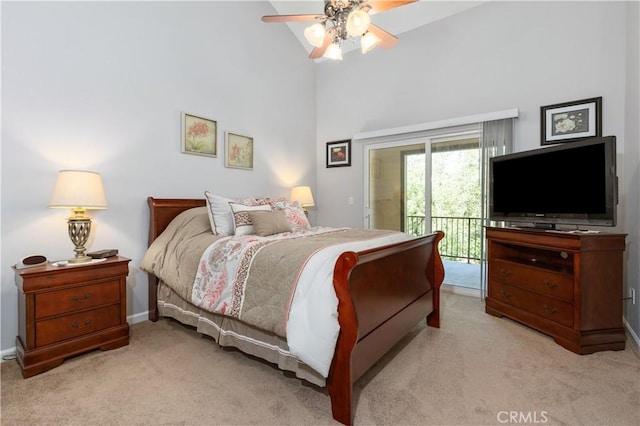 bedroom with access to outside, a high ceiling, ceiling fan, light carpet, and baseboards