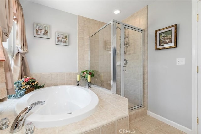 bathroom featuring shower with separate bathtub and tile patterned flooring