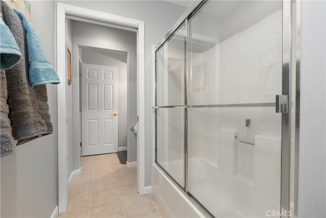 bathroom with enclosed tub / shower combo and tile patterned floors