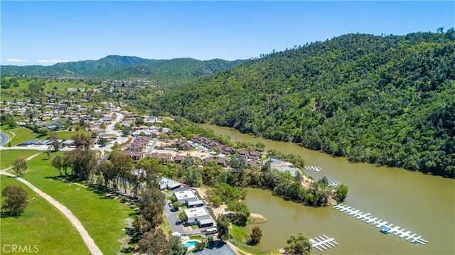 bird's eye view featuring a water and mountain view