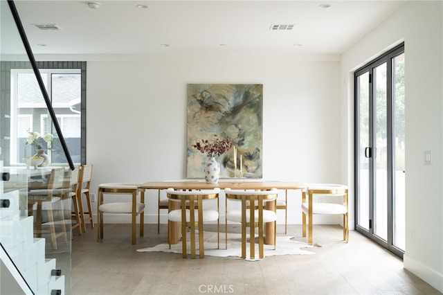 dining area with light hardwood / wood-style floors