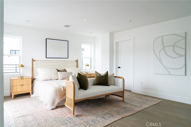 bedroom with wood-type flooring