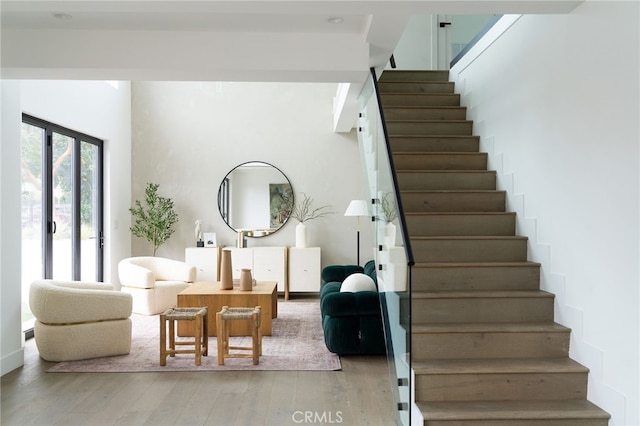 staircase with hardwood / wood-style flooring