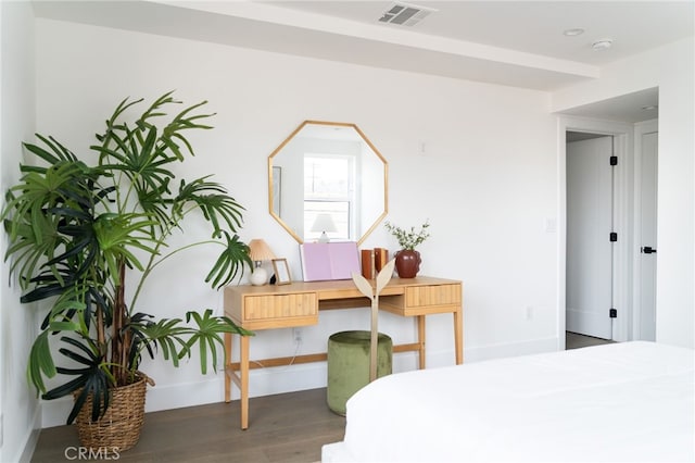 bedroom with dark hardwood / wood-style floors