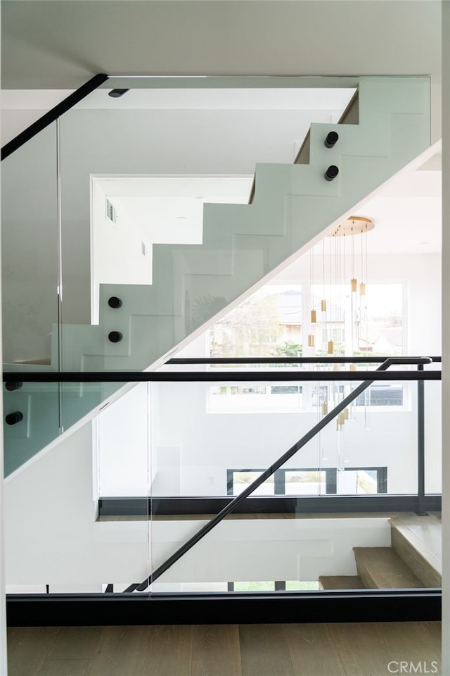 interior space featuring a notable chandelier and a healthy amount of sunlight