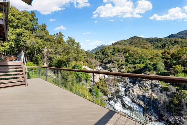 wooden deck featuring a mountain view