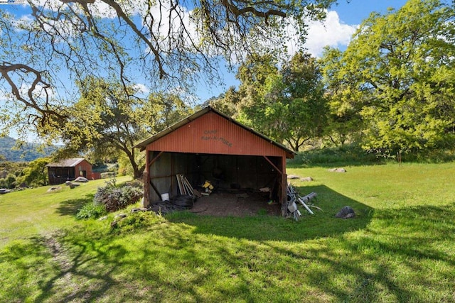 view of outdoor structure with a lawn