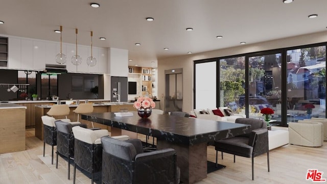 dining area featuring light wood-type flooring