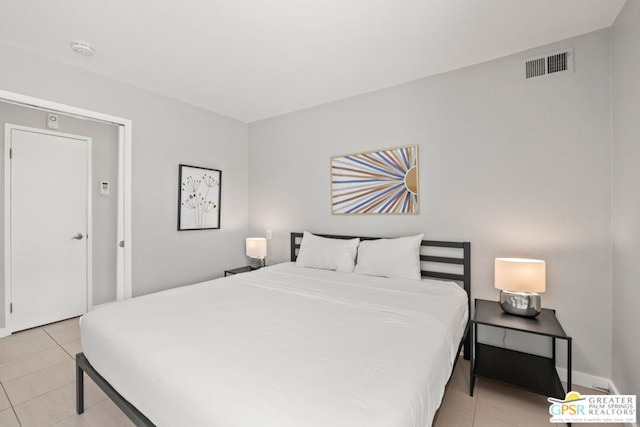 bedroom featuring light tile patterned flooring