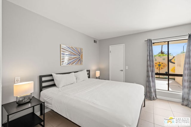 bedroom featuring light tile patterned floors