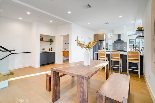 dining room with light hardwood / wood-style flooring