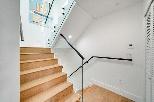 staircase featuring hardwood / wood-style flooring