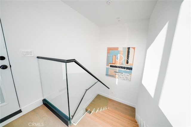 staircase featuring light hardwood / wood-style flooring