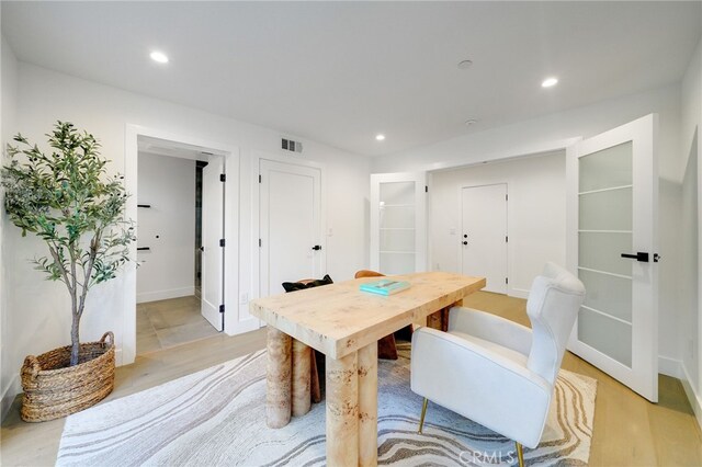 dining area with light hardwood / wood-style floors