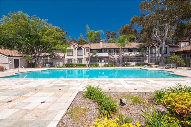 view of pool featuring a patio