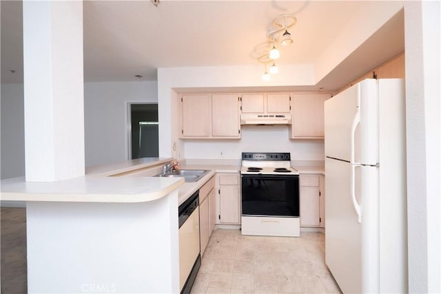 kitchen featuring kitchen peninsula, white appliances, and sink