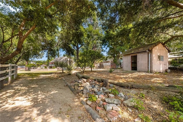 view of yard with a storage shed