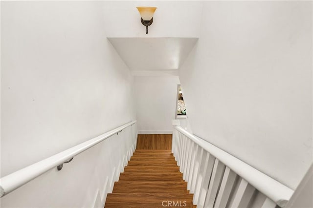 stairs with wood-type flooring