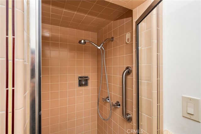 bathroom with tiled shower