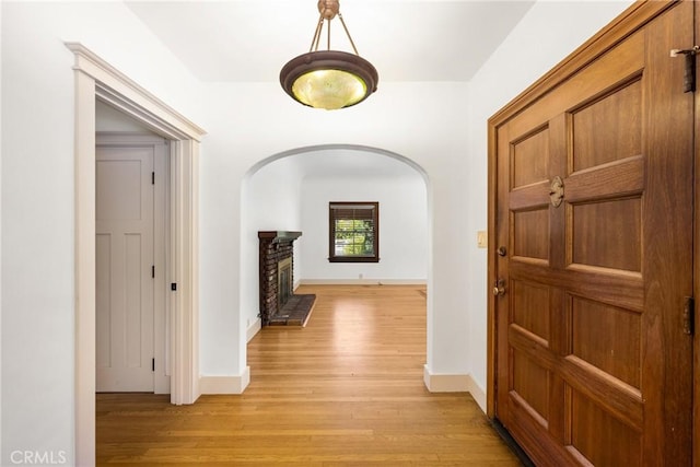 hall with light hardwood / wood-style floors