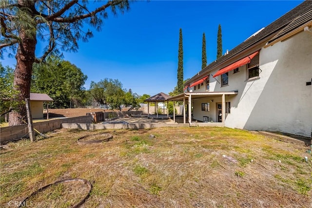 view of yard featuring a gazebo and a patio area