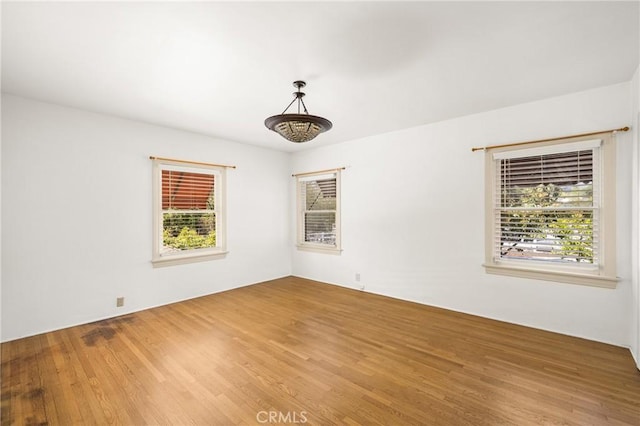 unfurnished room featuring hardwood / wood-style floors