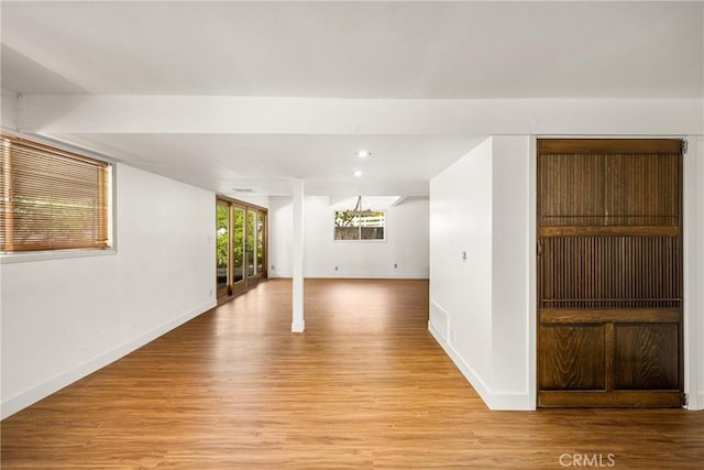 spare room featuring light hardwood / wood-style floors