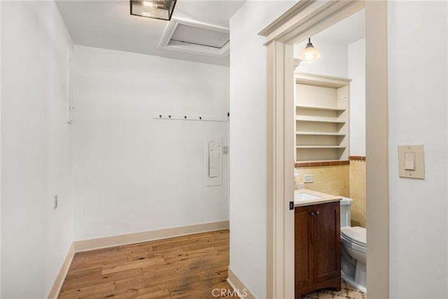 bathroom featuring vanity, hardwood / wood-style flooring, and toilet