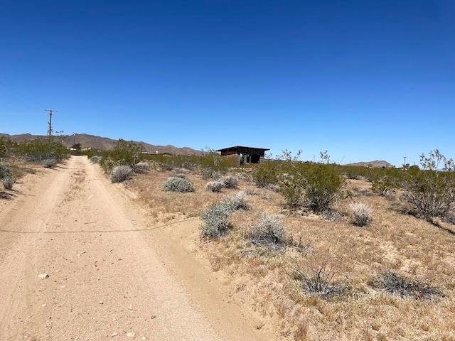 view of street featuring a mountain view and a rural view