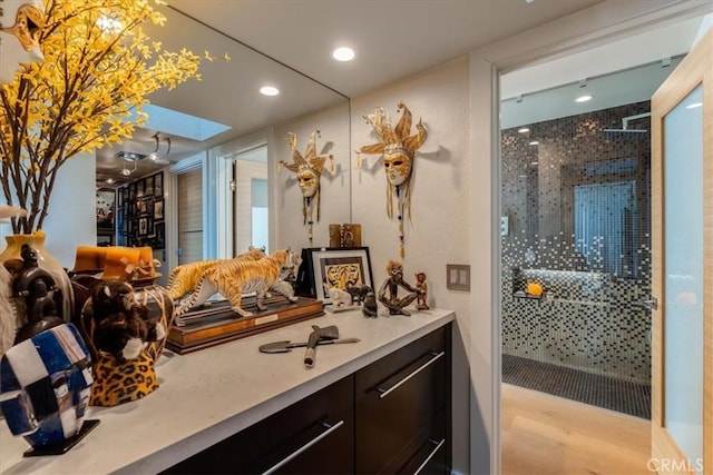 bathroom with vanity and wood-type flooring