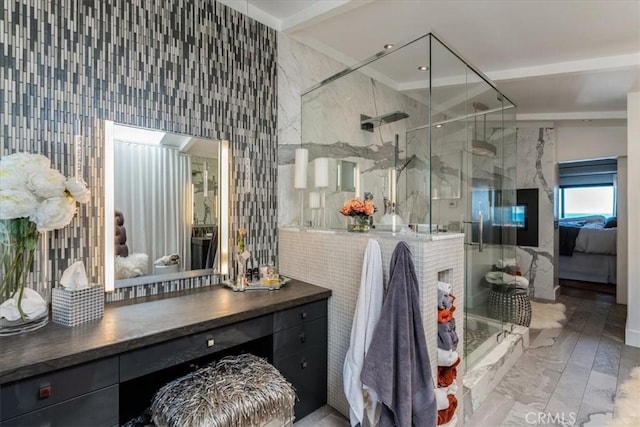 bathroom with vanity, tile walls, and walk in shower