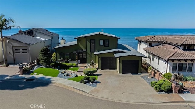 view of front of house with a water view and a garage