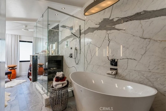 bathroom with a fireplace, tile walls, and independent shower and bath