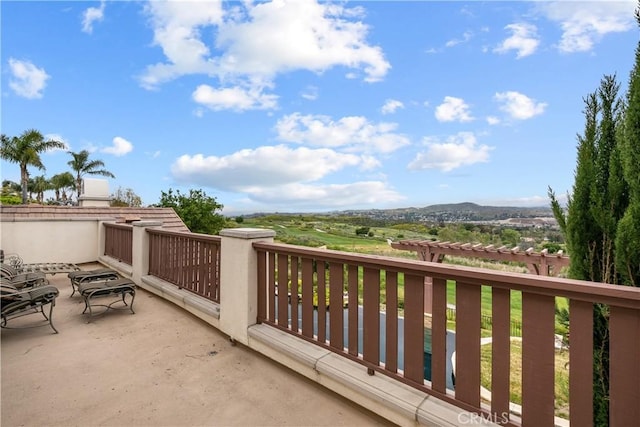 balcony featuring a mountain view