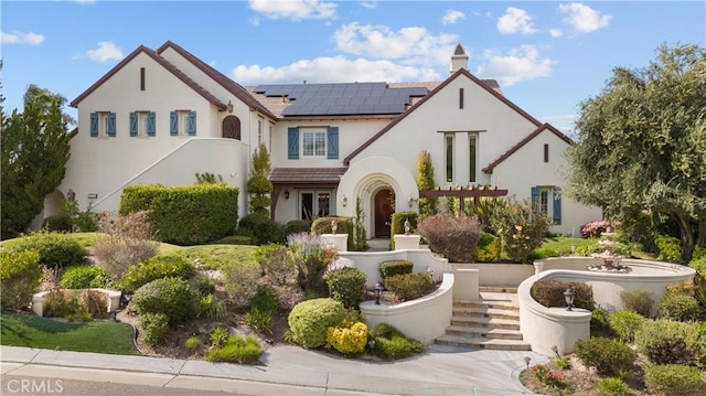 mediterranean / spanish home with solar panels