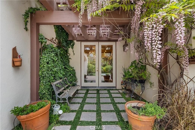 entrance to property with french doors and a patio