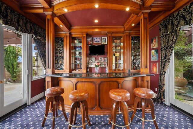 bar featuring dark colored carpet, crown molding, coffered ceiling, and beamed ceiling