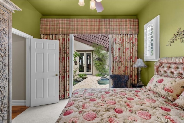 bedroom featuring ceiling fan, access to exterior, and carpet